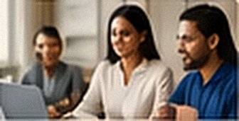 Staff and students at a meeting table